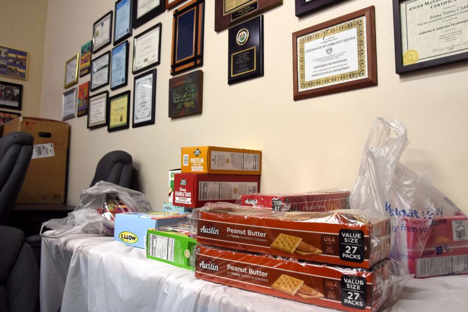 Donations pile up in the conference room at the Campesinos Sin Fronteras office in Somerton.