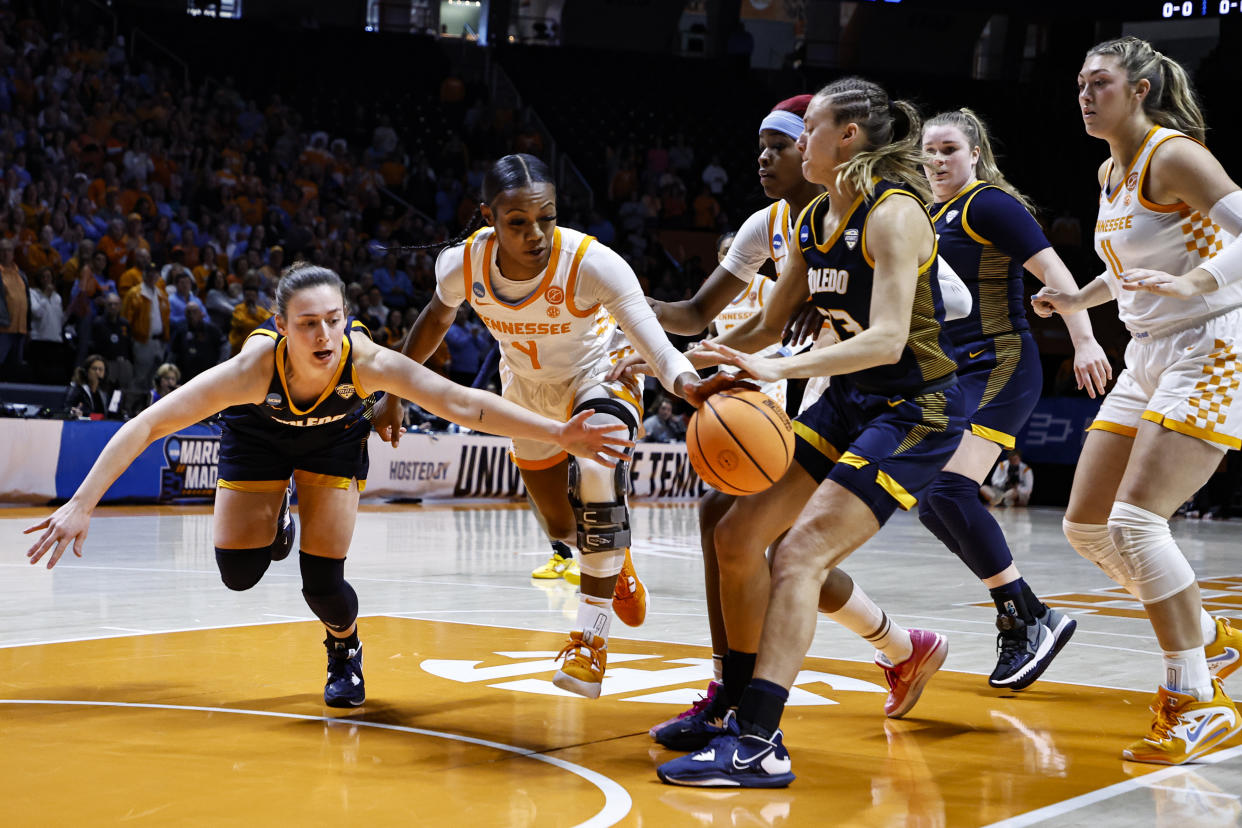 Toledo guard Sophia Wiard, left, battles for the ball with Tennessee guard Jordan Walker (4) in the first half of a second-round college basketball game in the NCAA Tournament, Monday, March 20, 2023, in Knoxville, Tenn. (AP Photo/Wade Payne)