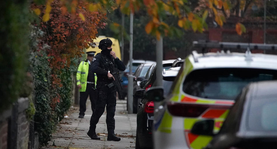 Armed officer patrols Liverpool street after explosion. Source: AP