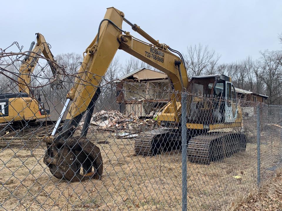 New Jersey American Water has begun knocking down four dilapidated buildings at Howard Commons in Eatontown to make room for a new water storage tank.