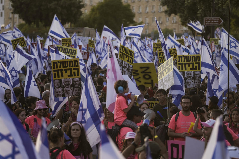 Israelis protest against a budget proposed by Prime Minister Benjamin Netanyahu's government ahead of a parliamentary vote and its plans to overhaul the country's judicial system in Jerusalem, Tuesday, May 23, 2023. (AP Photo/Mahmoud Illean)