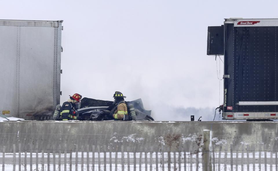 Emergency crews respond to a multi-vehicle accident in both the north and south lanes of Interstate 39/90 just north of the East Creek Road overpass on Friday, Jan. 27, 2023 in Turtle, Wis. Authorities say snowy conditions led to the massive traffic pile-up in southern Wisconsin on Friday that left Interstate 39/90 blocked for hours. (Anthony Wahl/The Janesville Gazette via AP)