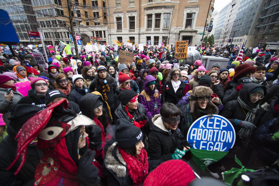 Participants of the Women's March march around the White House, Saturday, Jan. 18, 2020, in Washington, three years after the first march in 2017, the day after President Donald Trump was sworn into office. (AP Photo/Manuel Balce Ceneta)