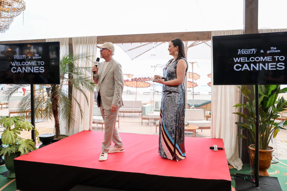 CANNES, FRANCE - MAY 16: Ron Howard speaks onstage next to Lily Gladstone during the Variety Welcome to Cannes Party at Lucia Beach on May 16, 2024 in Cannes, France.  (Photo by Victor Boyko/Variety via Getty Images)