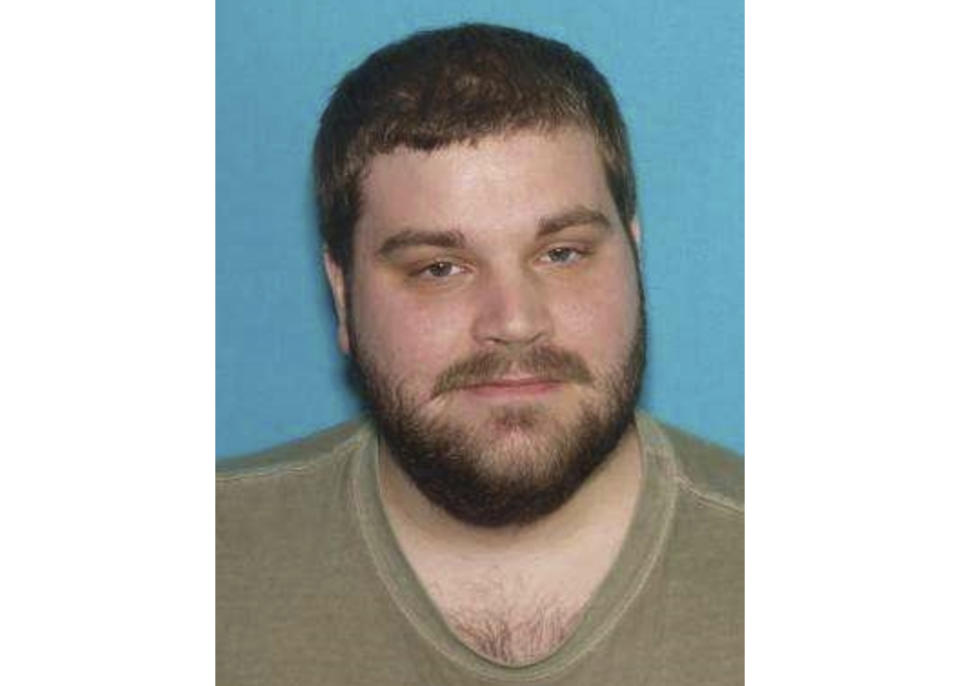 This undated Department of Motor Vehicles photo provided by the Maryland Heights Police Department shows Michael J. Honkomp. Honkomp has been charged with first-degree murder after he shot and killed a worker at a crowded suburban St. Louis community center before an officer who was outside the building rushed in and opened fire on the gunman, possibly preventing a much larger tragedy, authorities said Tuesday, Feb. 25, 2020. (Maryland Heights Police Department via AP)