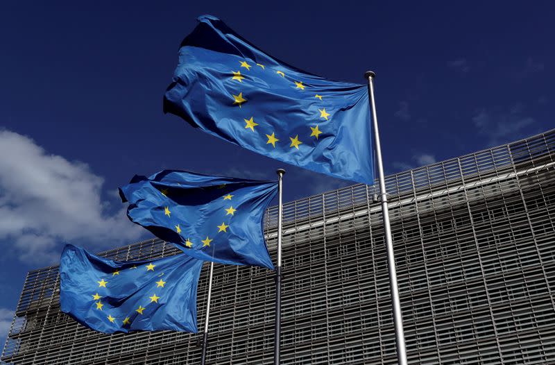 FILE PHOTO: European Union flags flutter outside the European Commission headquarters in Brussels