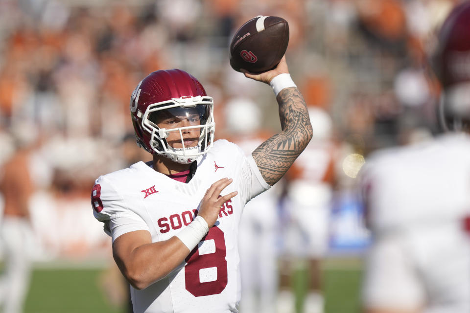 Oklahoma quarterback Dillon Gabriel (8) passes during warmups before an NCAA college football game against Texas at the Cotton Bowl in Dallas, Saturday, Oct. 7, 2023. (AP Photo/LM Otero)