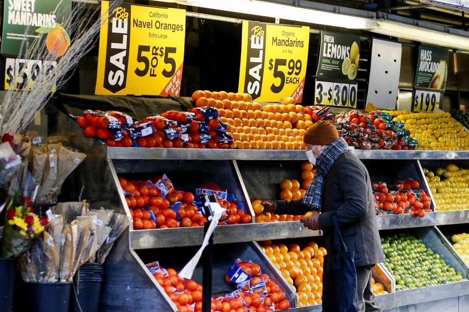 A man shops for fruit at a grocery store on Feb. 1, 2023, in New York. (Leonardo Munoz / VIEWpress/Corbis via Getty Images)