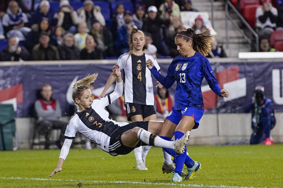 United States forward Alex Morgan (13) and Germany defender Kathrin Hendrich (3) fight for the ball during a women's international friendly soccer match Sunday, Nov. 13, 2022, in Harrison, N.J. (AP Photo/Eduardo Munoz Alvarez)