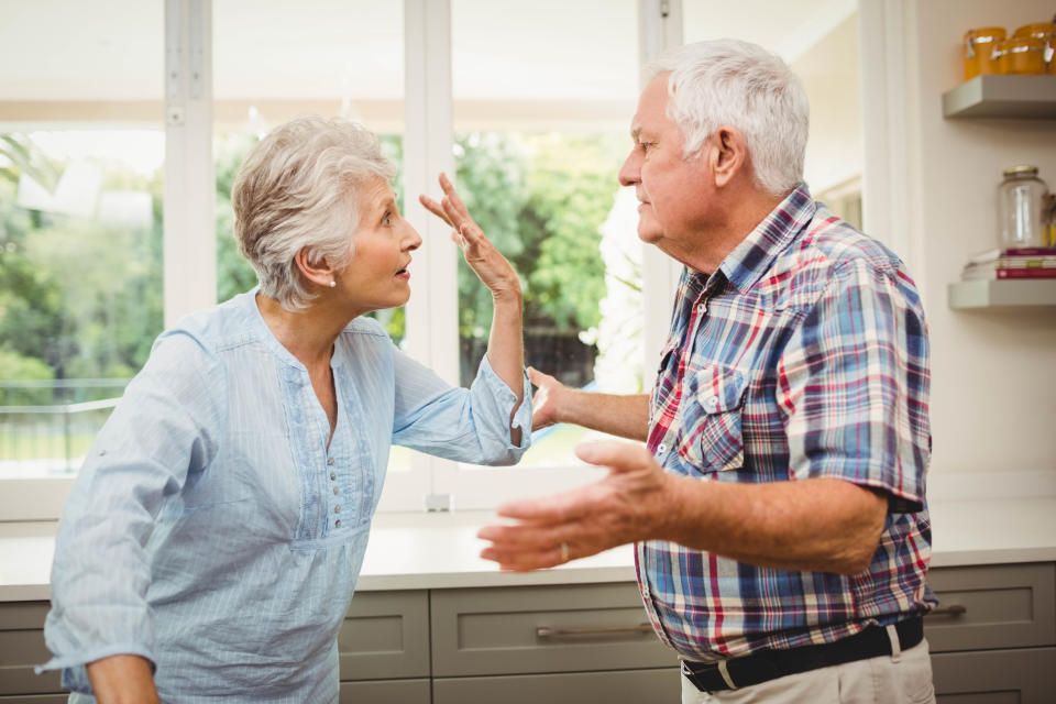 An elderly couple arguing