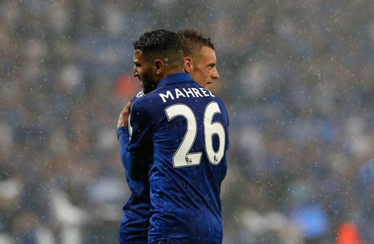 Leicester City's midfielder Riyad Mahrez (L) embraces striker Jamie Vardy during an English Premier League football match on May 7, 2016