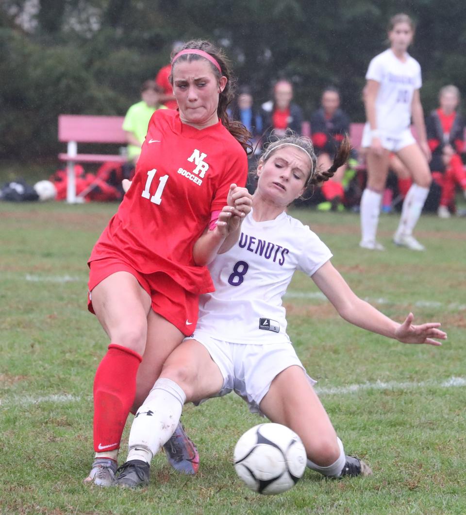 North Rockland's Alison Dwyer, right, fights for the ball with New Rochelle's Alexandra Rivera during their Section 1 Class AA quarterfinalat at North Rockland Oct. 24, 2022. North Rockland advances on penalty kicks 3-2, after the teams tied 1-1.