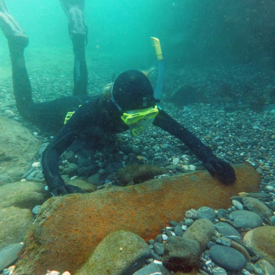 Molly Gibbins with a cannon on the wreck