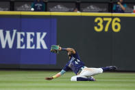 Seattle Mariners center fielder Julio Rodriguez makes a diving catch for the out of a ball hit by Oakland Athletics' Skye Bolt during the eighth inning of a baseball game Thursday, June 30, 2022, in Seattle. (AP Photo/John Froschauer)