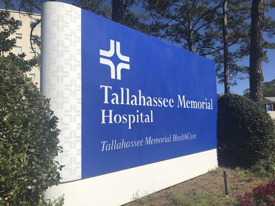 A sign stands outside Tallahassee Memorial Hospital on Friday, Feb. 3, 2023, in Tallahassee, Fla. The major hospital system in northern Florida said Friday it is diverting some emergency room patients and canceling surgeries after a security problem with information technology. (AP Photo/Anthony Izaguirre)