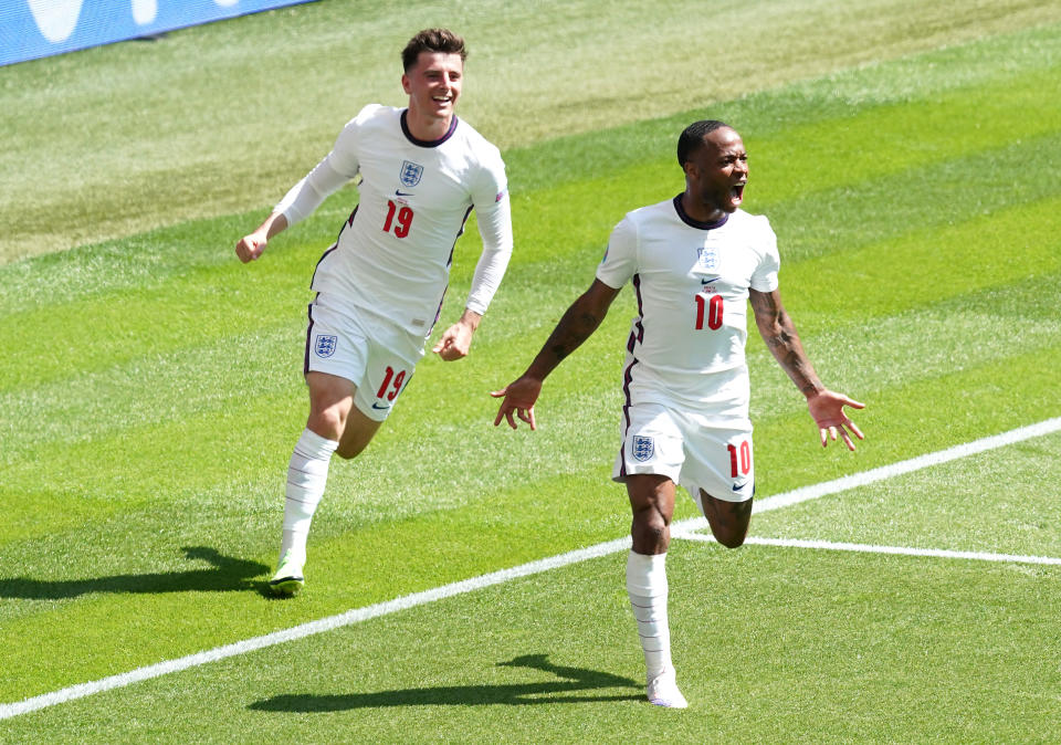 England's Raheem Sterling (right) celebrates scoring their side's first goal of the game during the UEFA Euro 2020 Group D match at Wembley Stadium, London. Picture date: Sunday June 13, 2021.