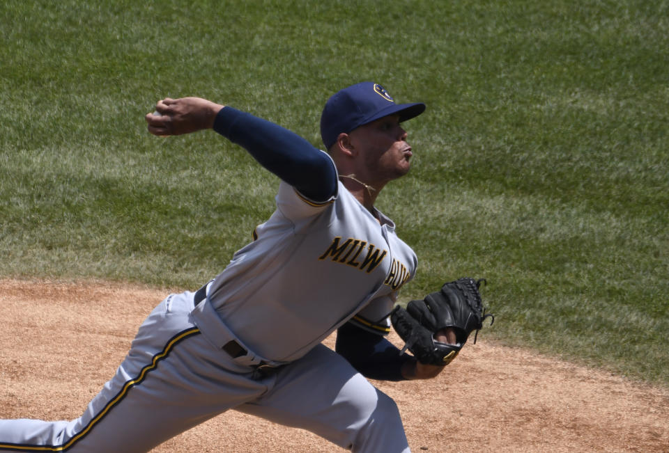 Milwaukee Brewers starting pitcher Freddy Peralta throws against the Chicago Cubs during the first inning of a baseball game Sunday, July, 26, 2020, in Chicago. (AP Photo/David Banks)