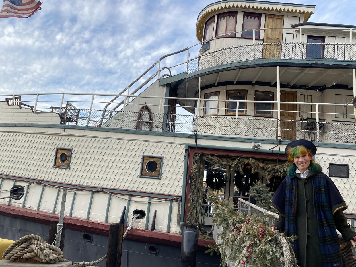 Victoria stands outside the Yankee Ferry.