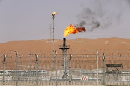 FILE PHOTO: Flames are seen at the production facility of Saudi Aramco's Shaybah oilfield in the Empty Quarter