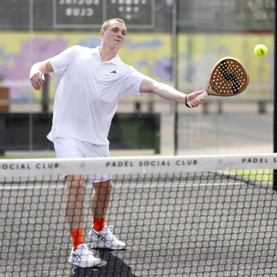 Alex Barton plays padel