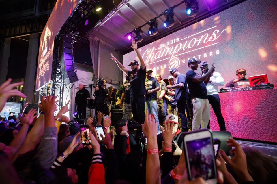 TORONTO, ON - JUNE 13: Toronto rapper Drake cheers on stage as Toronto Raptors beat the Golden State Warriors in Game Six of the NBA Finals, during a viewing party in Jurassic Park outside of Scotiabank Arena on June 13, 2019 in Toronto, Canada. (Photo by Cole Burston/Getty Images)