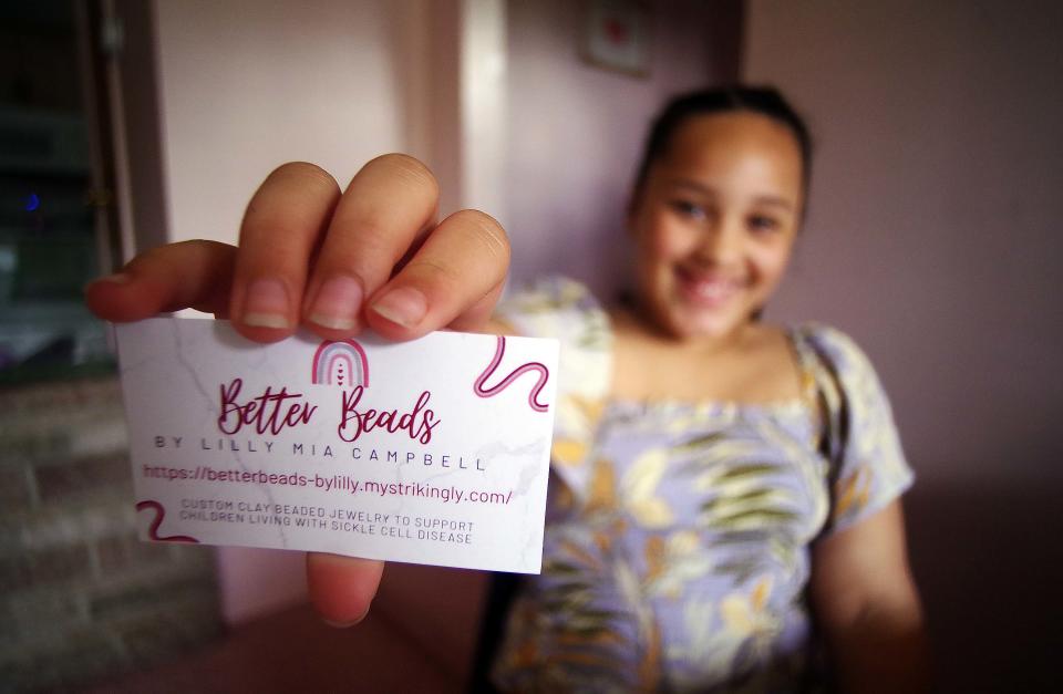 A very young entrepreneur, Lilly Campbell of Brockton, 9,  shows she intends to do business the right way by having business cards made for her company Better Beads.