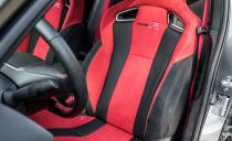 <p>The Honda's deep buckets (some Americans will find them too narrow) dressed in convincing faux suede glue driver and passenger in place for max-grip cornering while still offering long-haul comfort.</p>