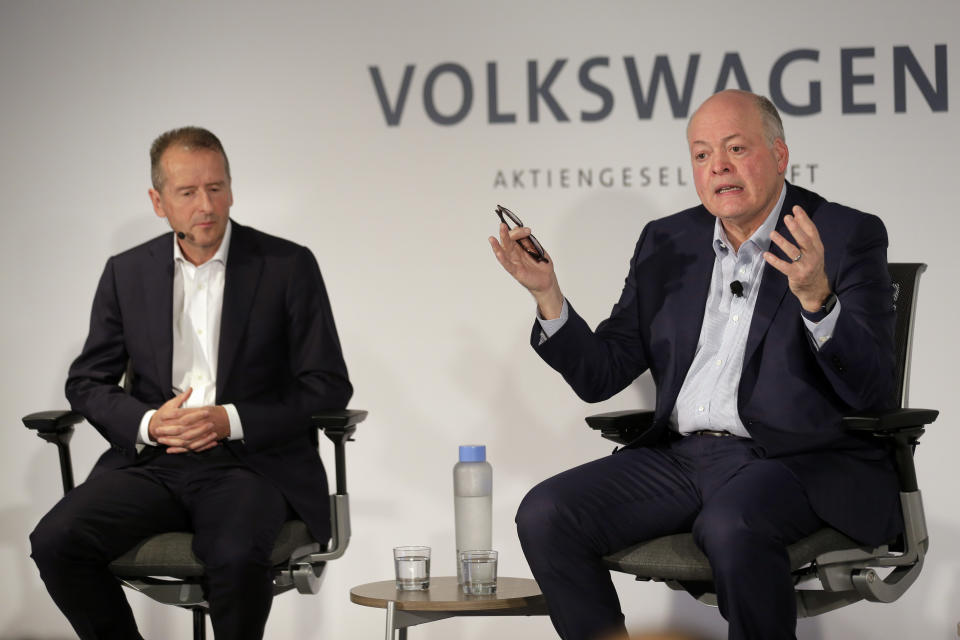 Ford CEO Jim Hackett, right, and Volkswagen CEO Herbert Diess participate in a news conference in New York, Friday, July 12, 2019. Volkswagen will sink $2.6 billion into a Pittsburgh autonomous vehicle company that's mostly owned by Ford as part of a broader partnership on electric and self-driving vehicles, the companies confirmed Friday. (AP Photo/Seth Wenig)