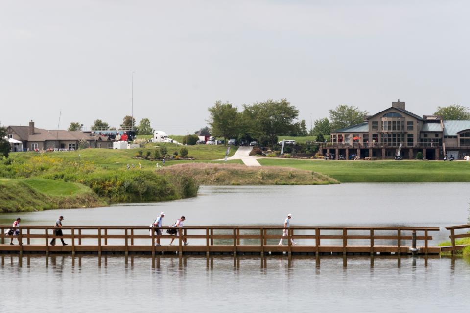 Brandon Wu, front, walks over a bridge to the sixth hole during the final round of the Korn Ferry Tour Championship presented by United Leasing & Finance at Victoria National Golf Course in Newburgh, Ind., Sunday, Aug. 30, 2020.