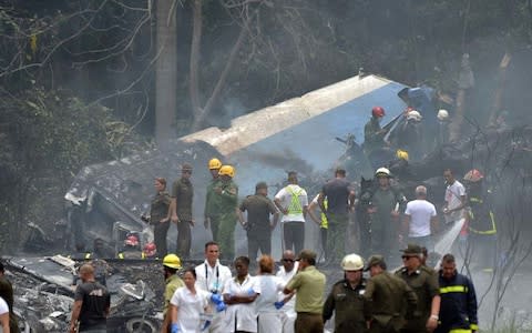 Officials at the scene of Friday's crash - Credit: Getty