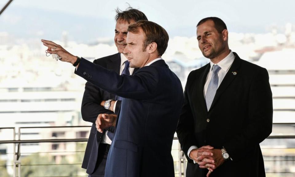 The Greek prime minister, Kyriakos Mitsotakis (left), speaks with the French president, Emmanuel Macron (centre), and Malta’s prime minister, Robert Abela, on the sidelines of the EUMed9 Summit, in Athens