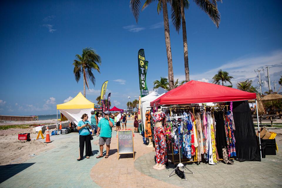 Patrons peruse the Farmers Market at Times Square on Fort Myers Beach on Friday, Sept. 8, 2023. The market recently opened on FridayÕs at the location which was decimated in Hurricane Ian.