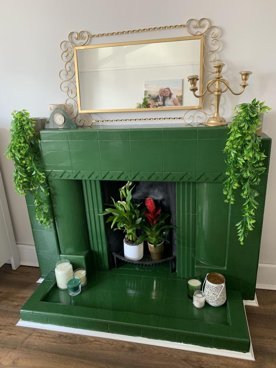 <p>'Our drab old ceramic fireplace was looking very outdated, but money is tight so getting it knocked out would have cost too much. I therefore bought a tin of <a href="https://www.housebeautiful.com/uk/decorate/bathroom/a2255/bathroom-decorating-ideas-greenery/" rel="nofollow noopener" target="_blank" data-ylk="slk:green;elm:context_link;itc:0;sec:content-canvas" class="link ">green</a> paint - my favourite colour!'</p>