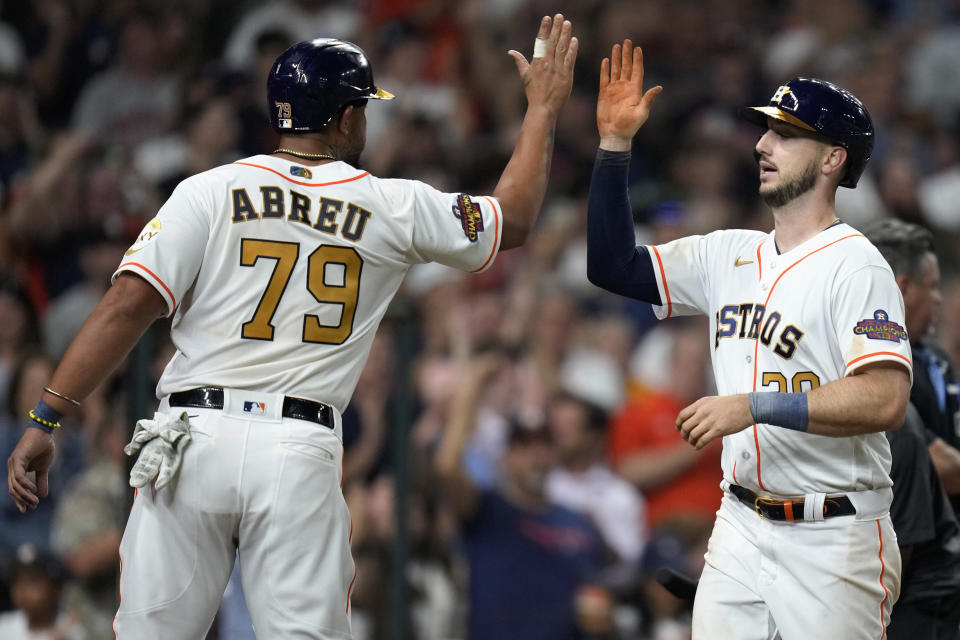 Houston Astros' Kyle Tucker, right, celebrates his two-run home run against the Chicago White Sox with Jose Abreu during the sixth inning of a baseball game Friday, March 31, 2023, in Houston. (AP Photo/Eric Christian Smith)