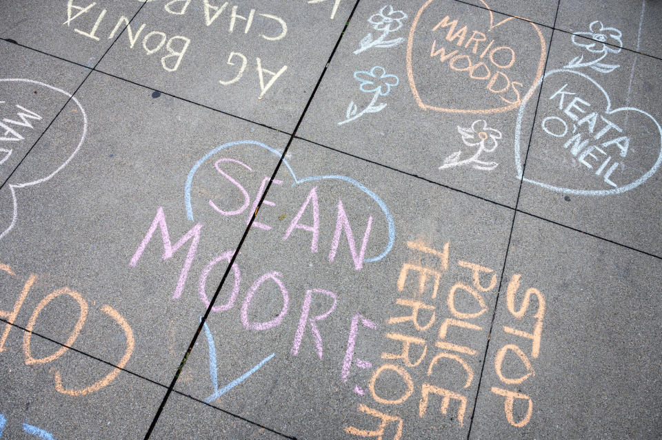 Messages chalked on the sidewalk in front of the California attorney general's office in San Francisco on March 6, 2023.