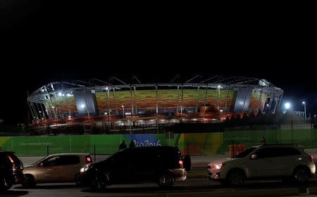 Cars drive in front of 2016 Rio Olympic Park in Rio de Janeiro, Brazil, July 31, 2016. REUTERS/Ricardo Moraes