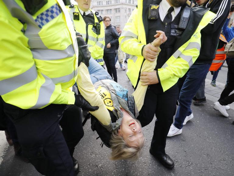 Extinction Rebellion - live: Climate activists dance with police officers while three charged over Tube protest face month in custody