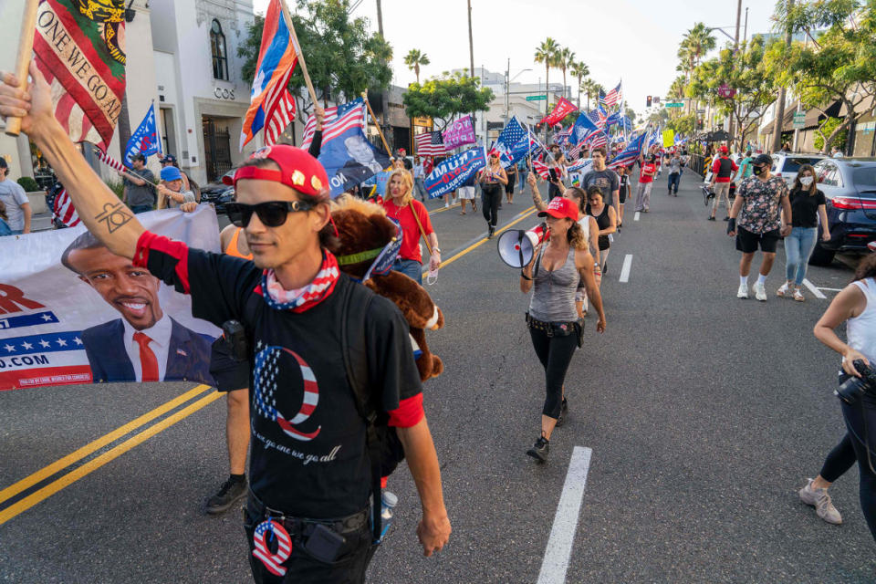 <div class="inline-image__caption"><p>Rally organizer and supporter of President Donald Trump, Shiva Bagheri (center) marches with a megaphone through Beverly Hills, California, Oct. 10, 2020.</p></div> <div class="inline-image__credit">Kyle Grillot/AFP via Getty Images</div>