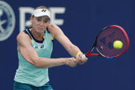 Elena Rybakina, of Kazakhstan, hits a return to Victoria Azarenka, of Belarus, during a quarterfinal match at the Miami Open tennis tournament, Thursday, March 28, 2024, in Miami Gardens, Fla. (AP Photo/Lynne Sladky)