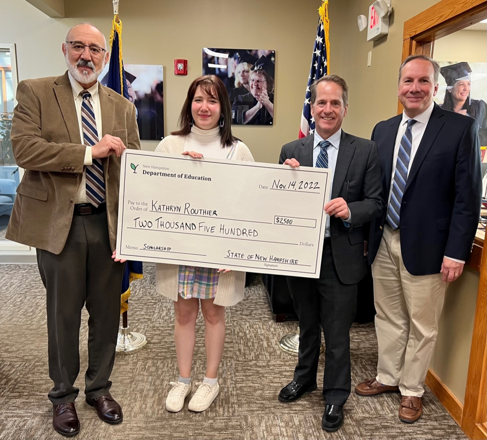 From left to right are Deputy Adjutant General Warren Perry, scholarship recipient Kathryn Routhier, Commissioner Frank Edelblut and Stephen Appleby, director of NHED’s Division of Educator Support and Higher Education.