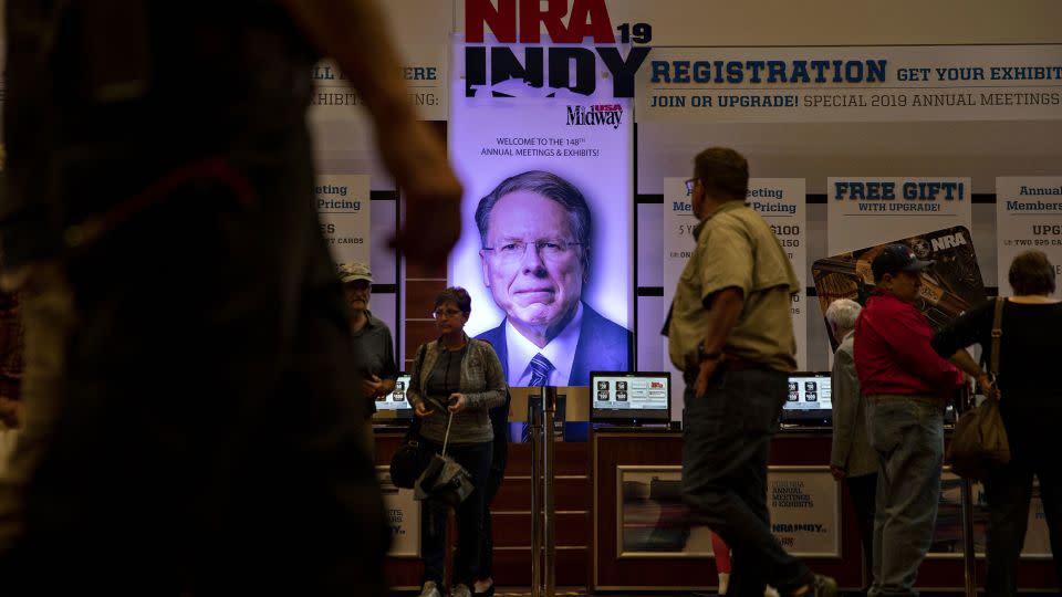 Wayne LaPierre's image hangs above a registration desk ahead of the NRA annual meeting at the Indiana Convention Center in Indianapolis in 2019. LaPierre says he "will never stop supporting the NRA and its fight to defend Second Amendment freedom." - Daniel Acker/Bloomberg/Getty Images