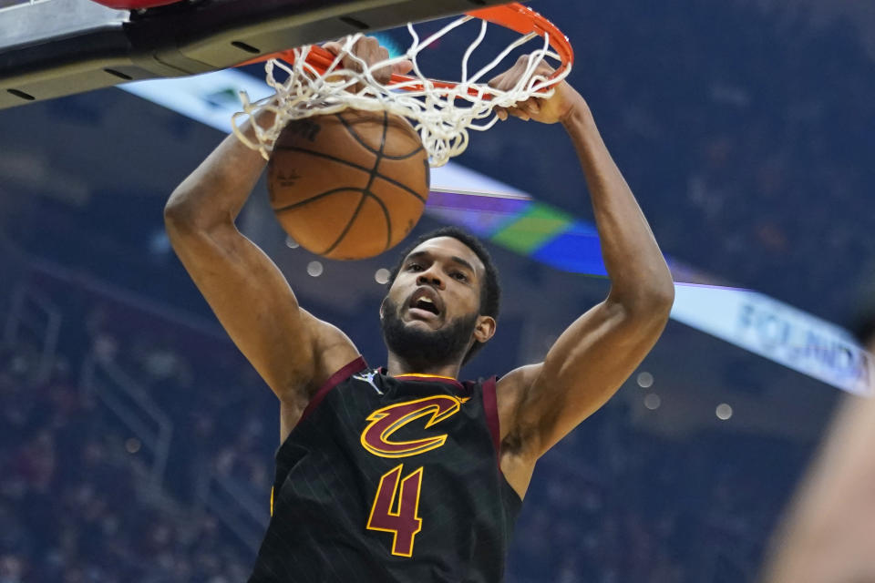 Cleveland Cavaliers' Evan Mobley dunks the ball against the Oklahoma City Thunder in the first half of an NBA basketball game, Saturday, Jan. 22, 2022, in Cleveland. (AP Photo/Tony Dejak)