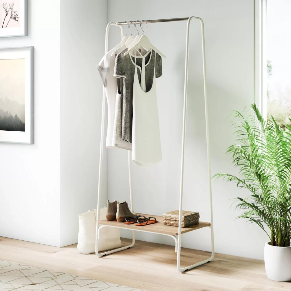 The rack, with a hanging rod and bottom shelf