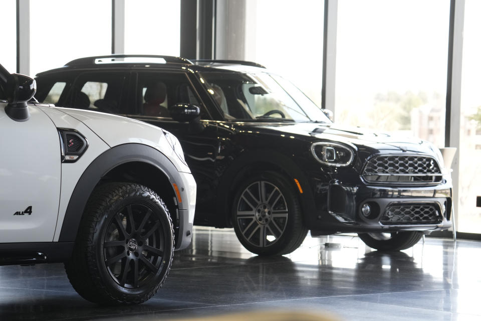 Unsold 2023 Cooper Countryman S sports-utility vehicles sit on showroom floor of a Mini dealership Thursday, April 20, 2023, in Highlands Ranch, Colo. (AP Photo/David Zalubowski)