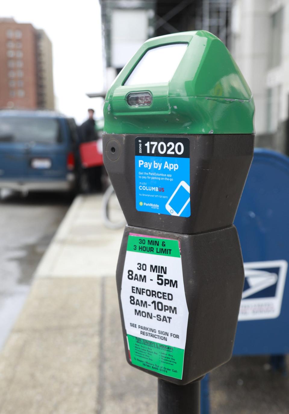 The remainder of parking meters in Columbus are expected to be replaced with kiosks soon. As shown on the sticker on this meter, drivers can pay for parking with an app. [Barbara J. Perenic/Dispatch]