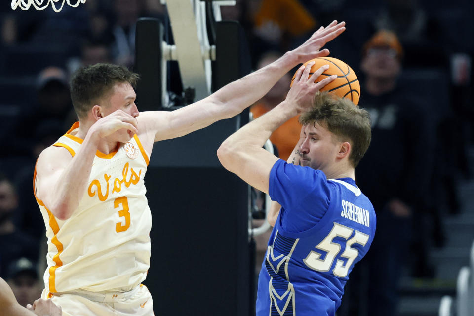 Creighton guard Baylor Scheierman (55) looks to pass as Tennessee guard Dalton Knecht (3) reaches in during the second half of a Sweet 16 college basketball game in the NCAA Tournament, Friday, March 29, 2024, in Detroit. (AP Photo/Duane Burleson)