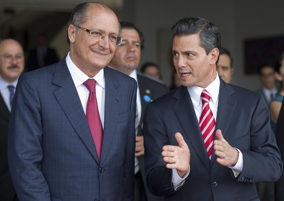 Mexico's President-elect Enrique Pena Nieto, right, talks with Sao Paulo's Governor Geraldo Alckmin in Sao Paulo, Brazil, Wednesday, Sept. 19, 2012. (AP Photo/Andre Penner)