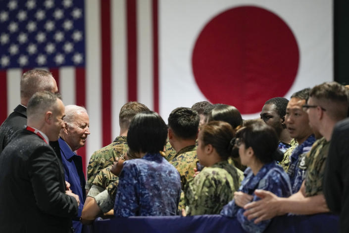 President Joe Biden, third left, greets troops upon his arrival at Marine Corps Air Station Iwakuni in Iwakuni, Japan, Thursday, May 18, 2023. Biden made the stop on his way to attend the G-7 Summit in Hiroshima, Japan. (AP Photo/Susan Walsh)