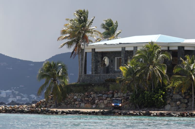 FILE PHOTO: A man in a golf cart is seen at Little St. James Island, one of the properties of financier Jeffrey Epstein, near Charlotte Amalie