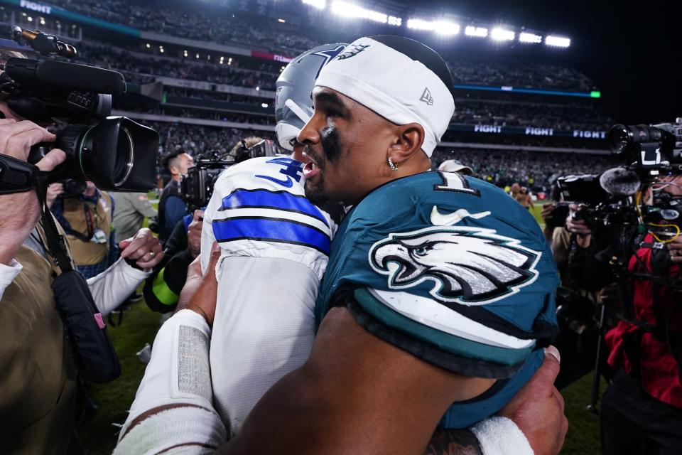 Philadelphia Eagles quarterback Jalen Hurts (1) embraces Dallas Cowboys quarterback Dak Prescott (4) after an NFL football game Sunday, Nov. 5, 2023, in Philadelphia. (AP Photo/Chris Szagola)